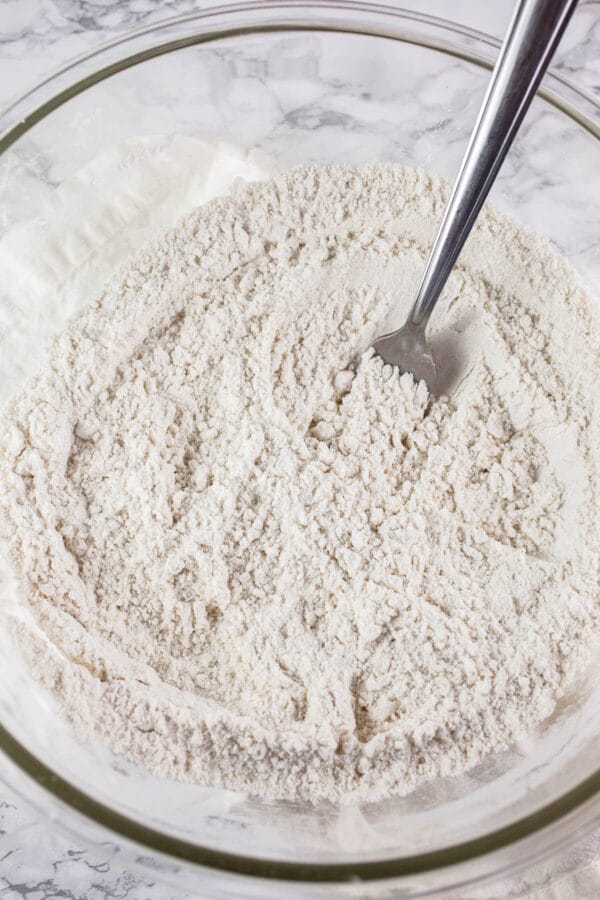 Dry ingredients in large glass mixing bowl.