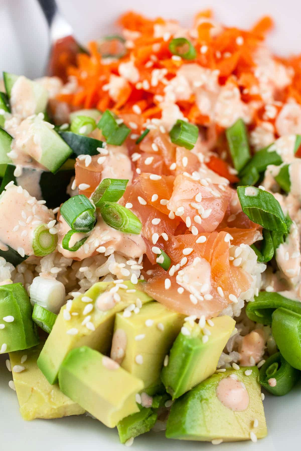 Smoked salmon rice bowl with spicy dressing.
