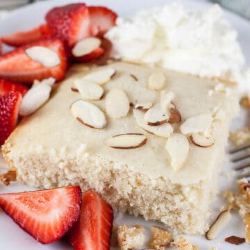 Scandinavian almond cake with whipped cream and fresh strawberries.