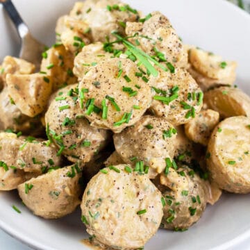 Chipotle potato salad in white bowl.