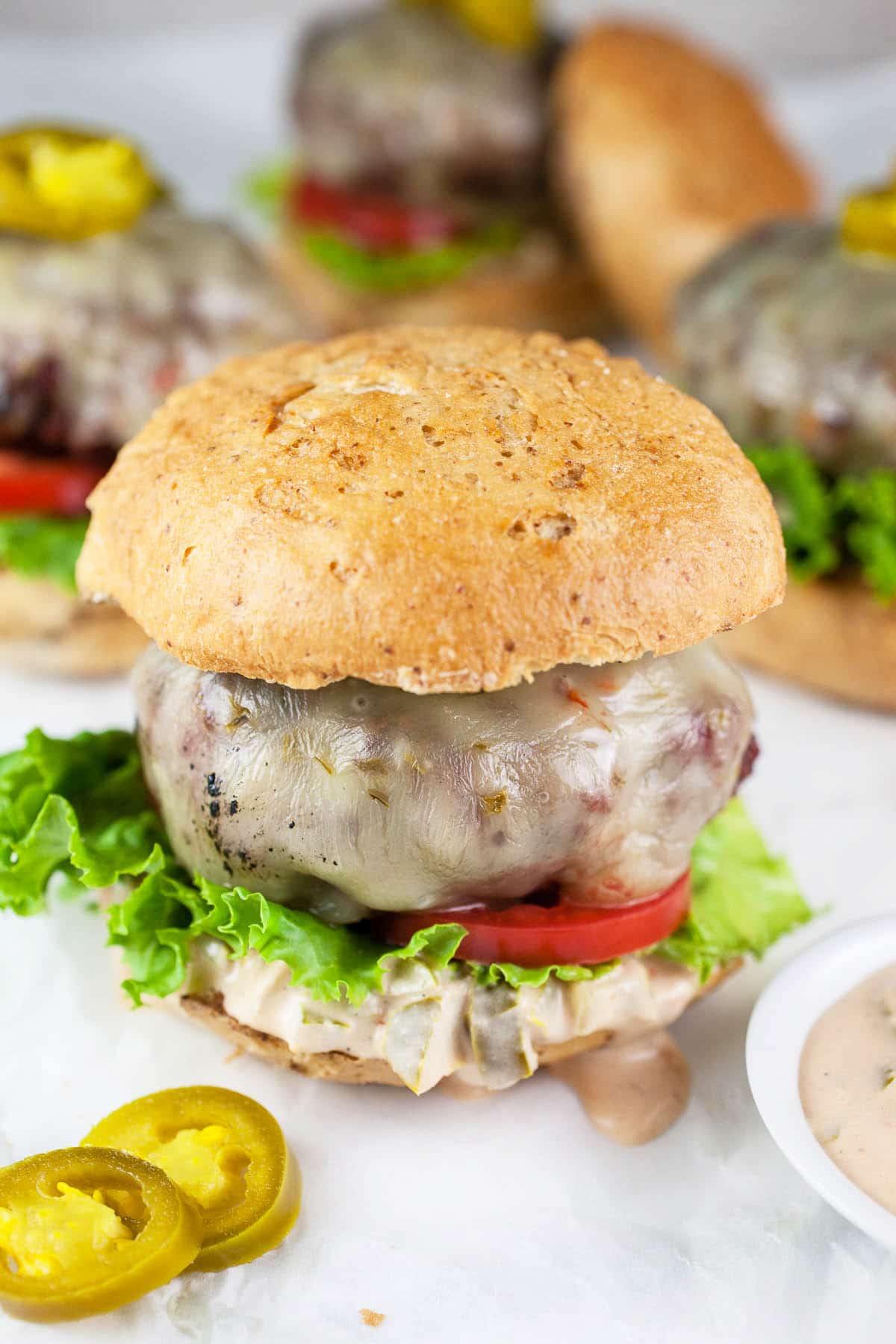 Grilled burgers with jalapeno burger sauce.