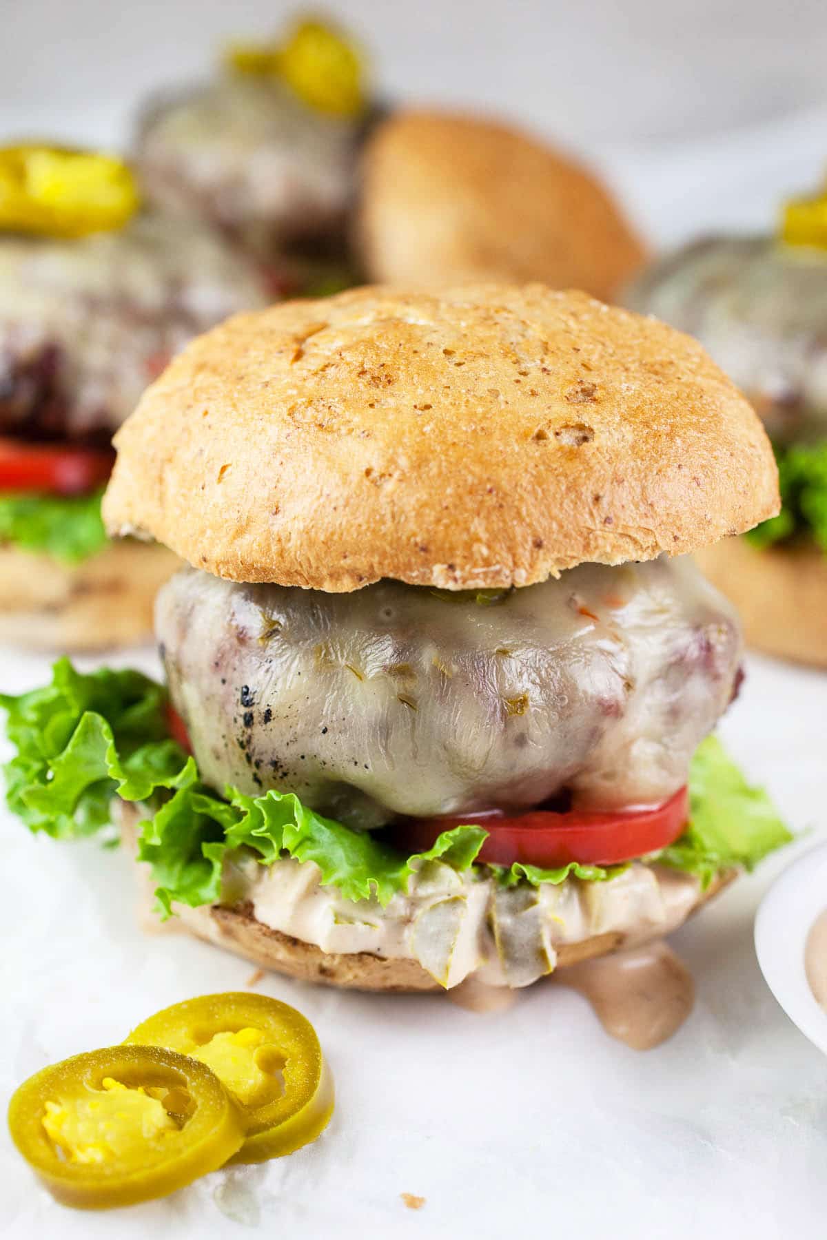 Grilled burgers with jalapeno burger sauce.