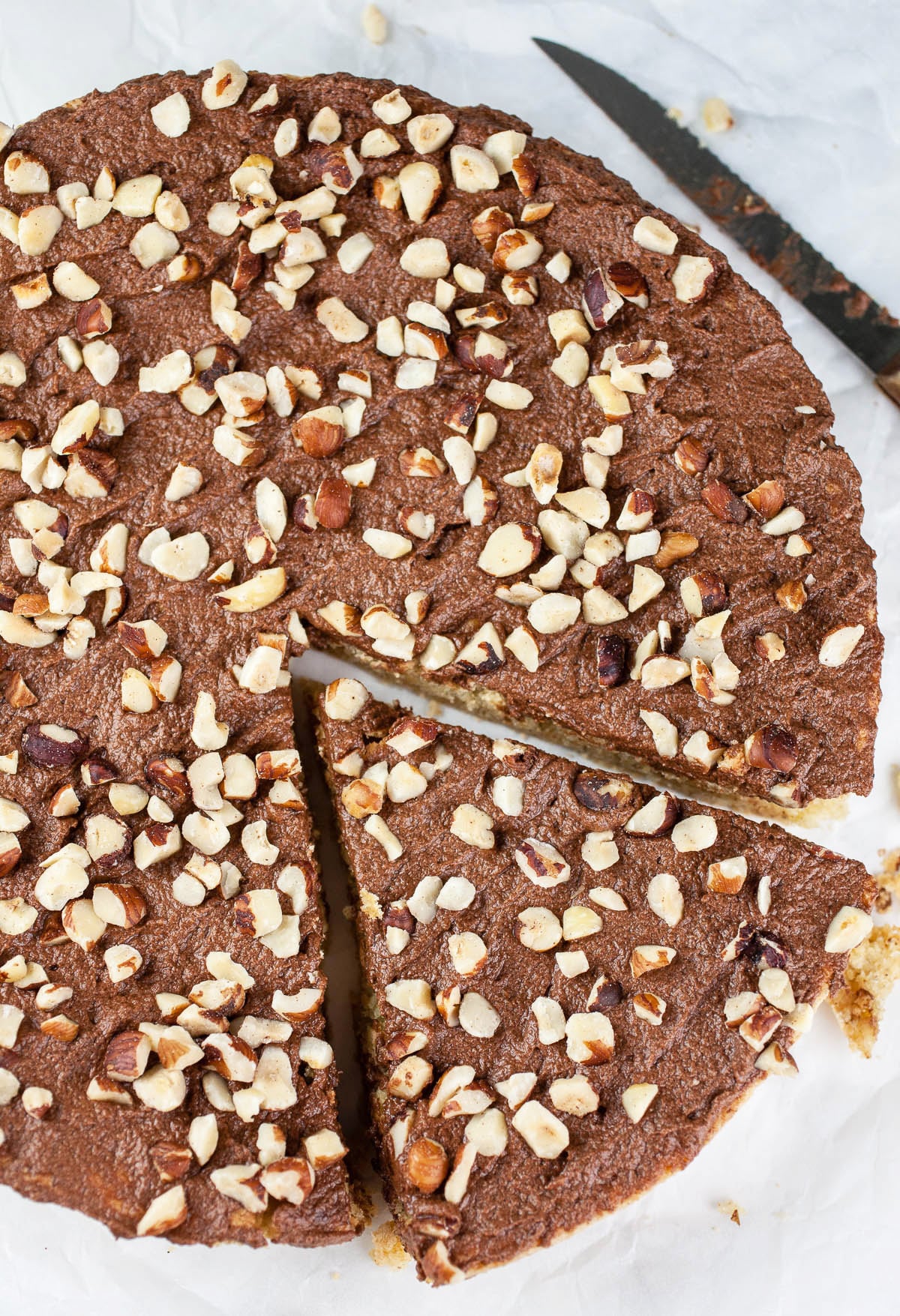 One slice cut from Italian chocolate hazelnut cake.