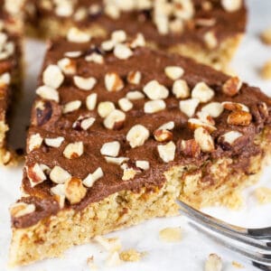 Slice of Italian chocolate hazelnut cake with fork.