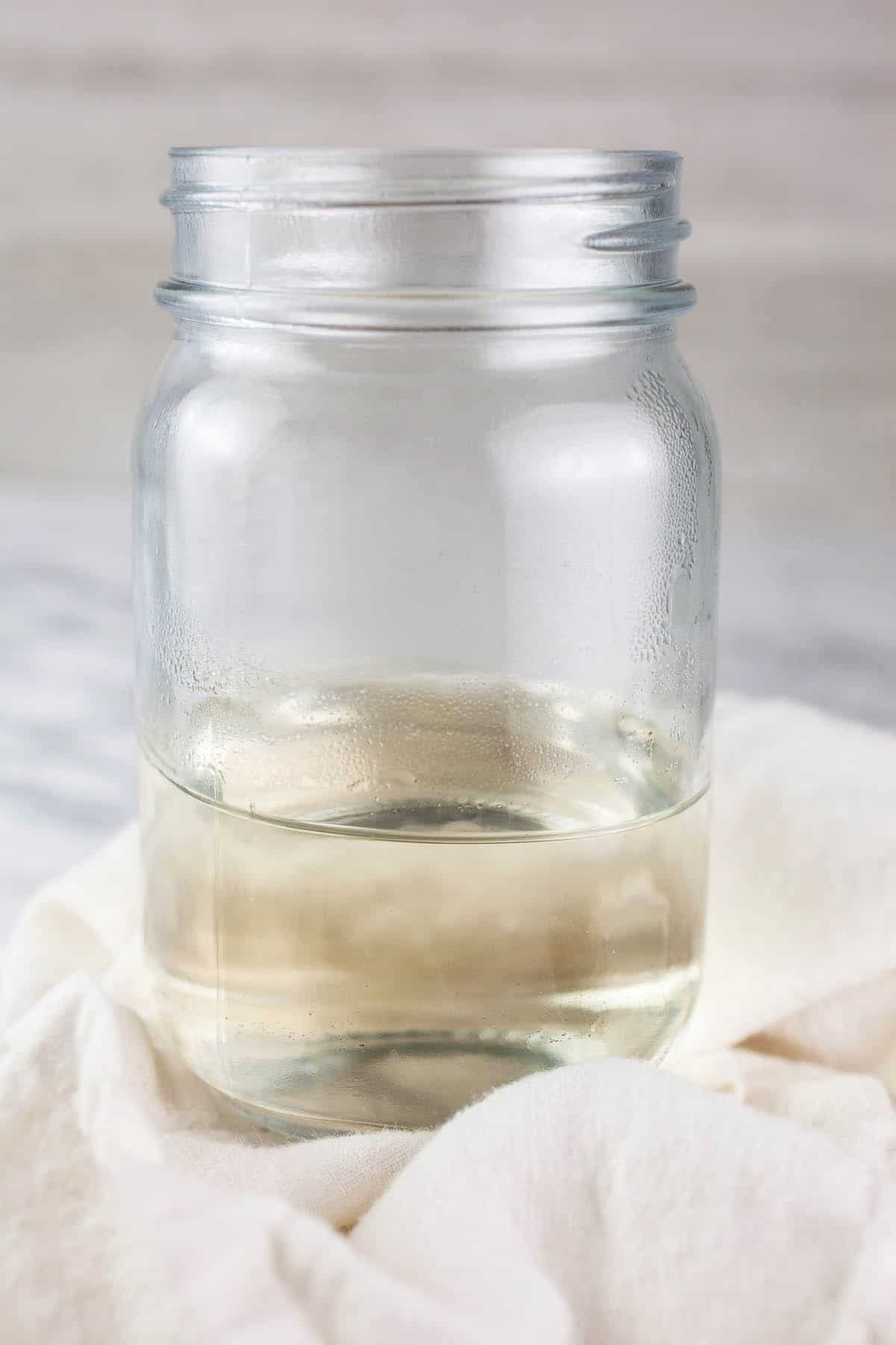 Simple syrup in glass mason jar.