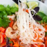 Vietnamese shrimp salad with noodles, veggies, and herbs.