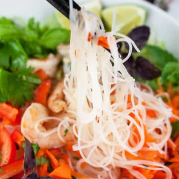 Vietnamese shrimp salad with noodles, veggies, and herbs.