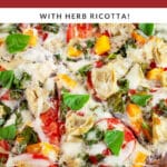 Sliced Famers Market Pizza garnished with fresh basil and Parmesan cheese.