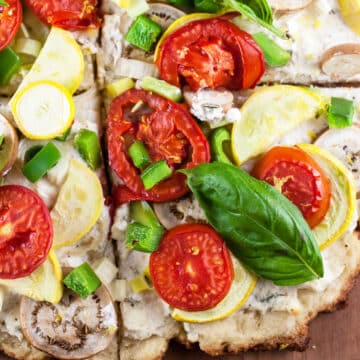 Farmers market pizza cut into slices.