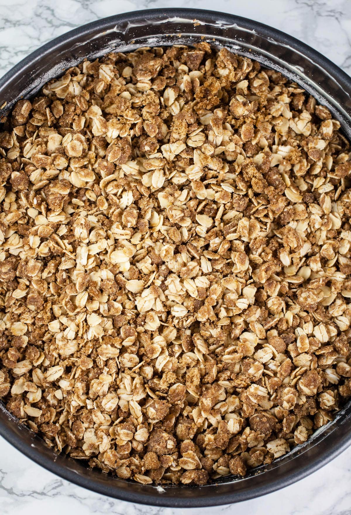 Unbaked coffee cake in springform pan.