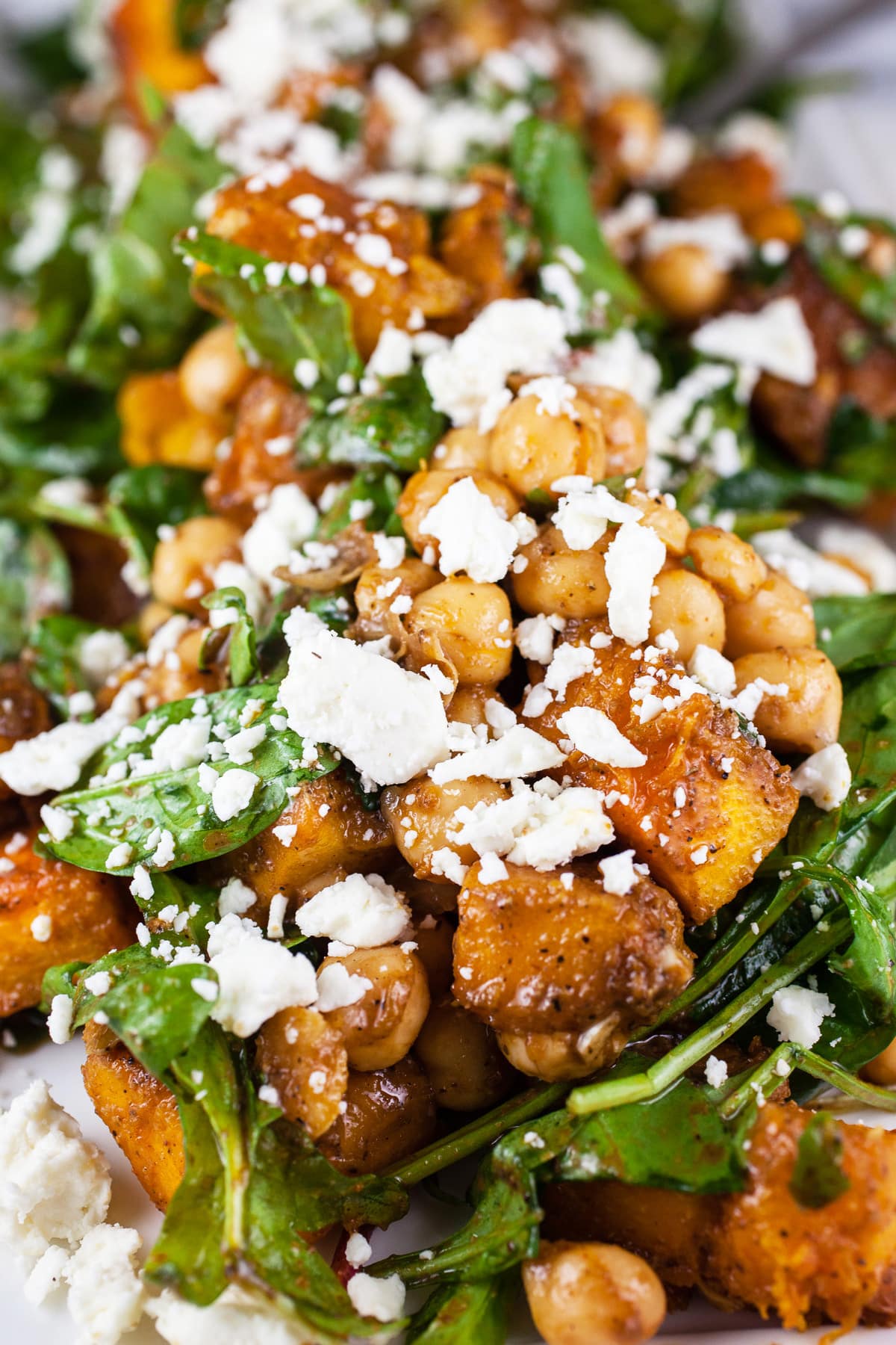 Roasted pumpkin chickpea salad with feta on serving platter.