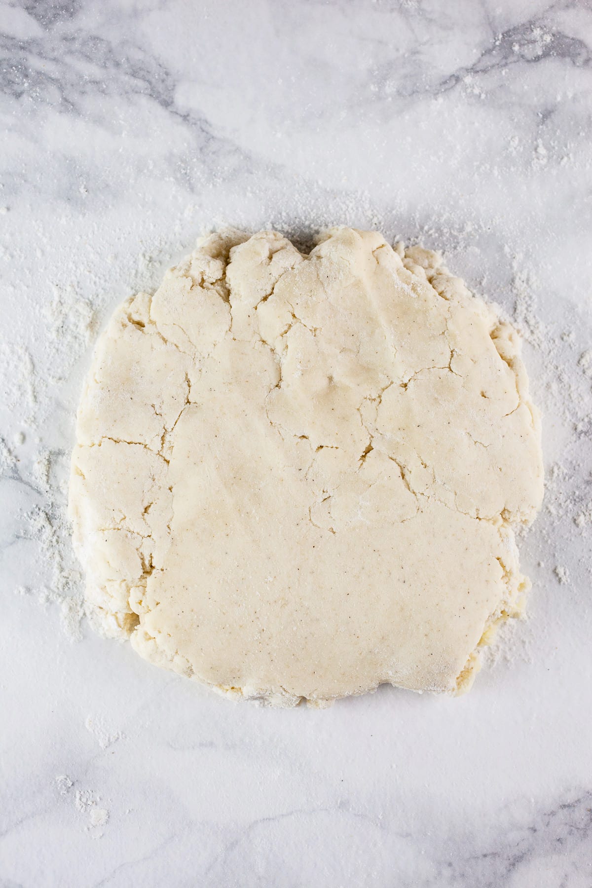 Shortbread dough on white surface.