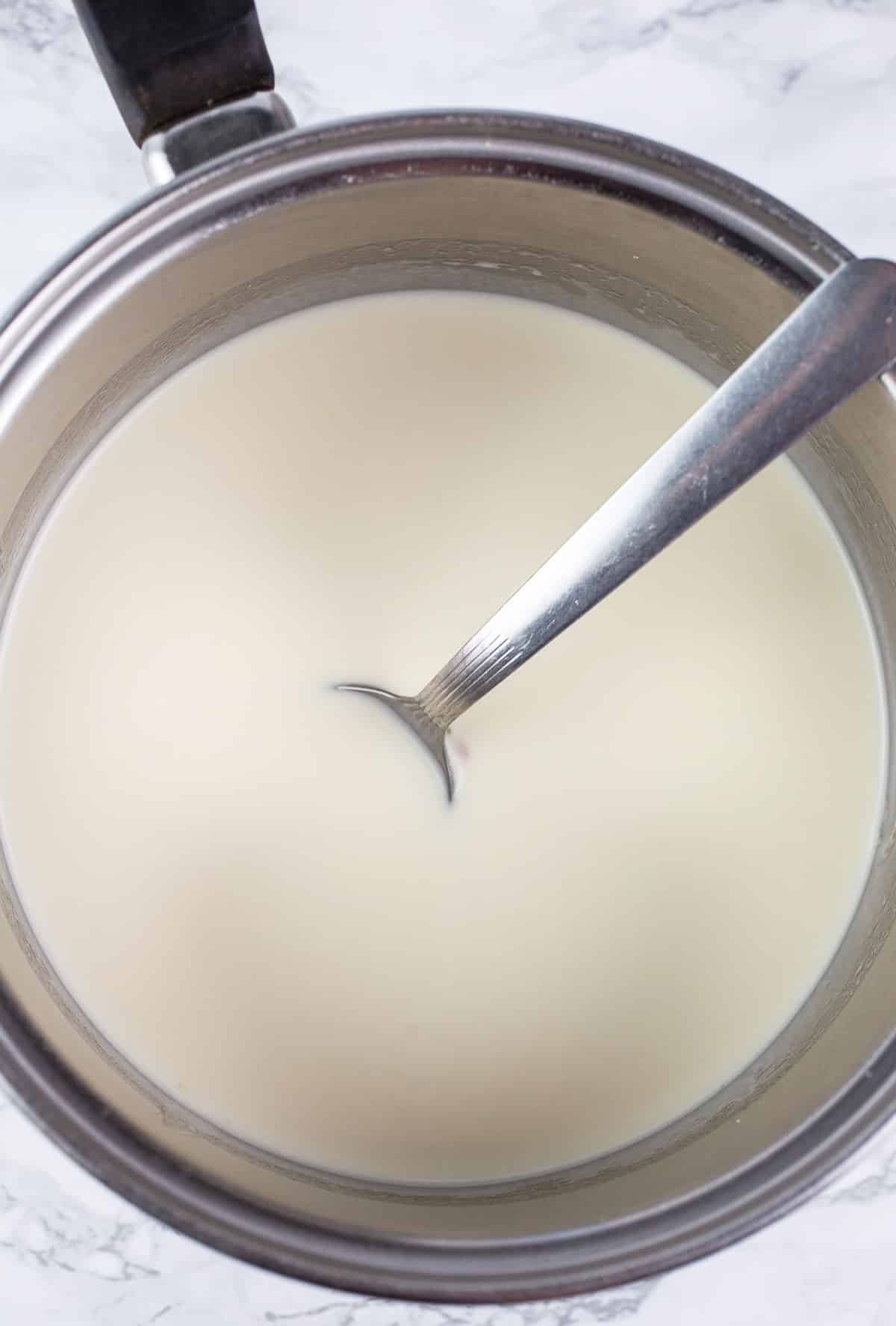 Heavy cream mixture in sauce pan.