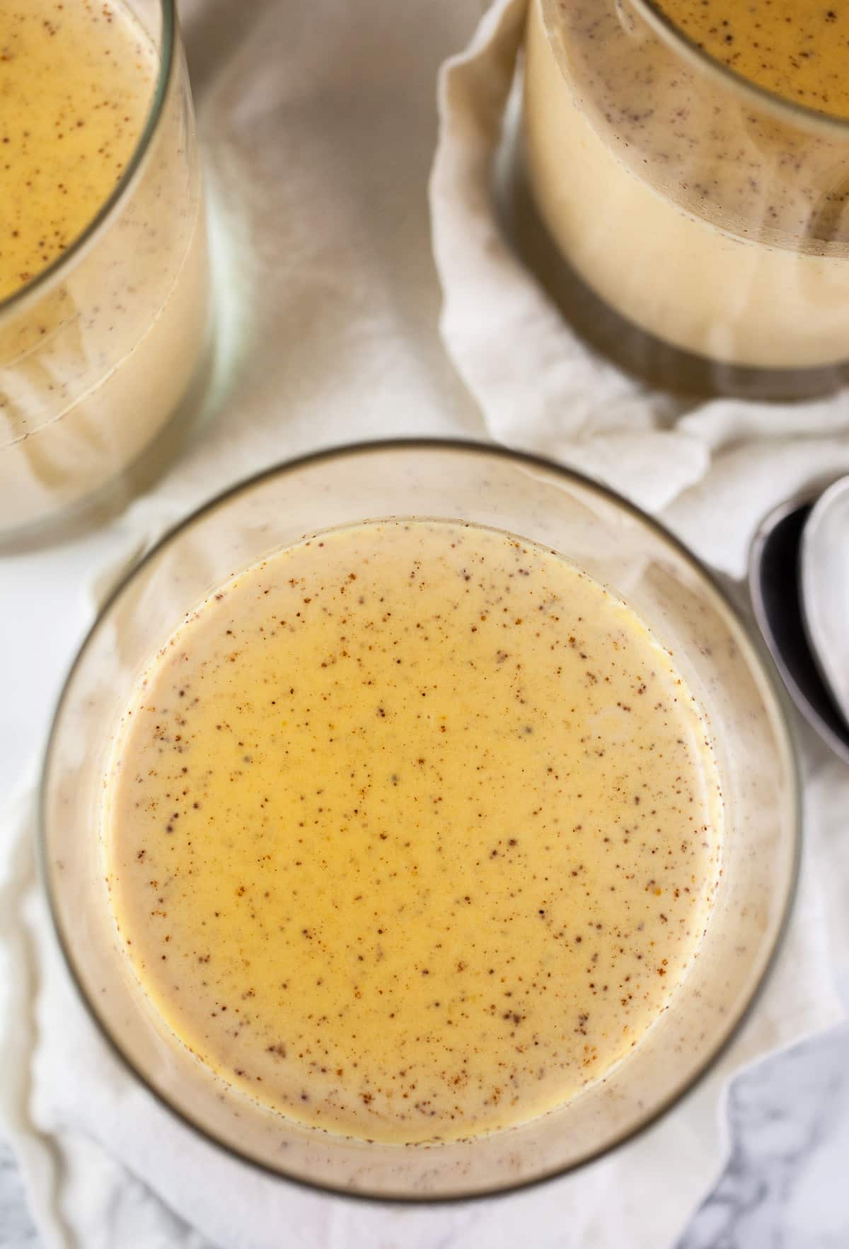 Chilled panna cotta in small glasses.