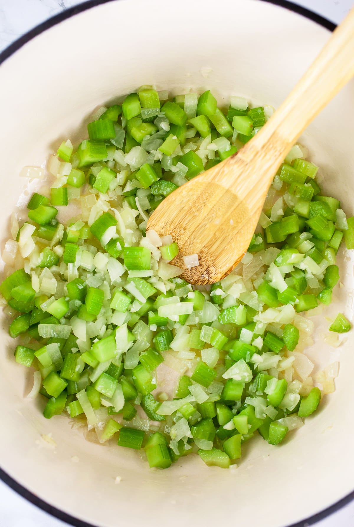 Garlic, onions, and celery sautéed in Dutch oven.