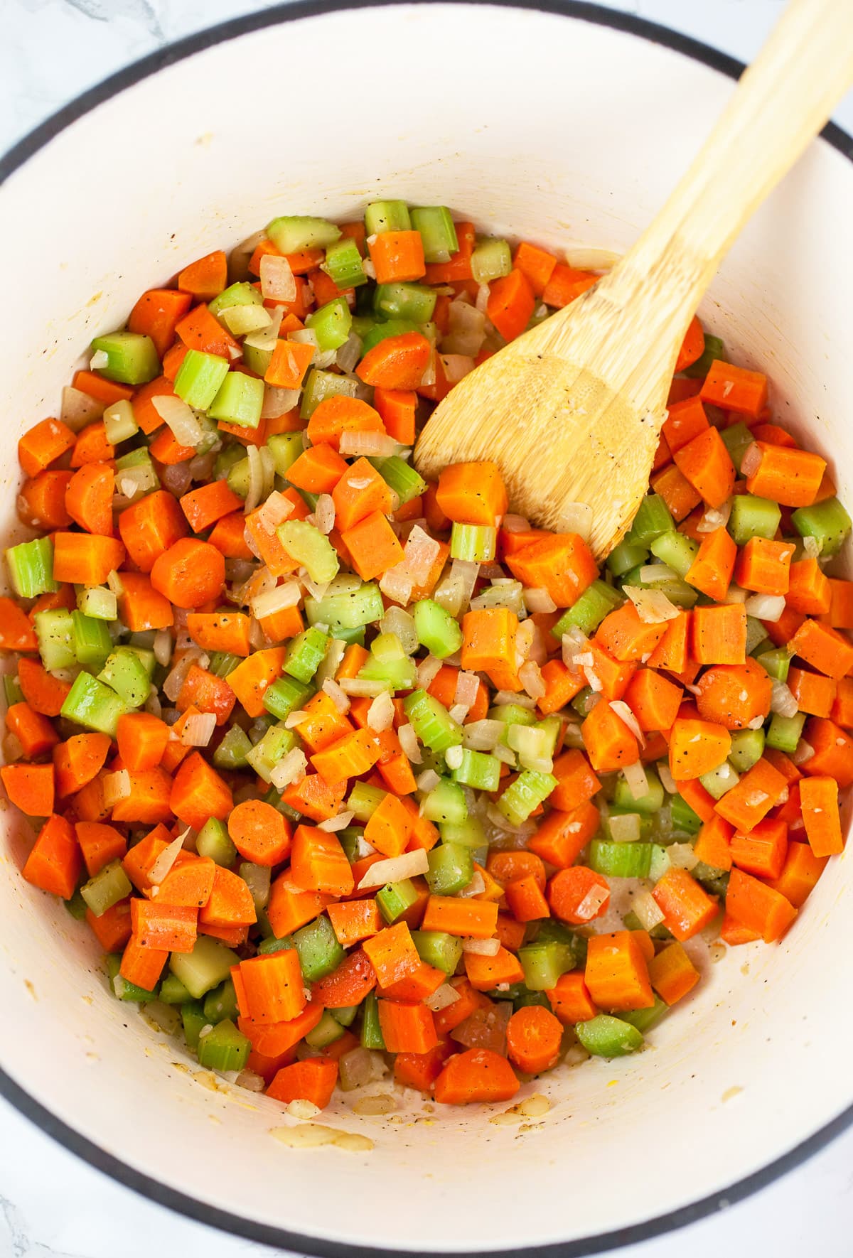 Garlic, onions, celery, and carrots sautéed in Dutch oven.