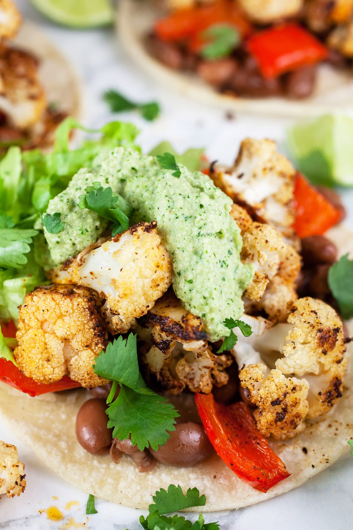 Roasted veggie tacos with cashew cilantro sauce.