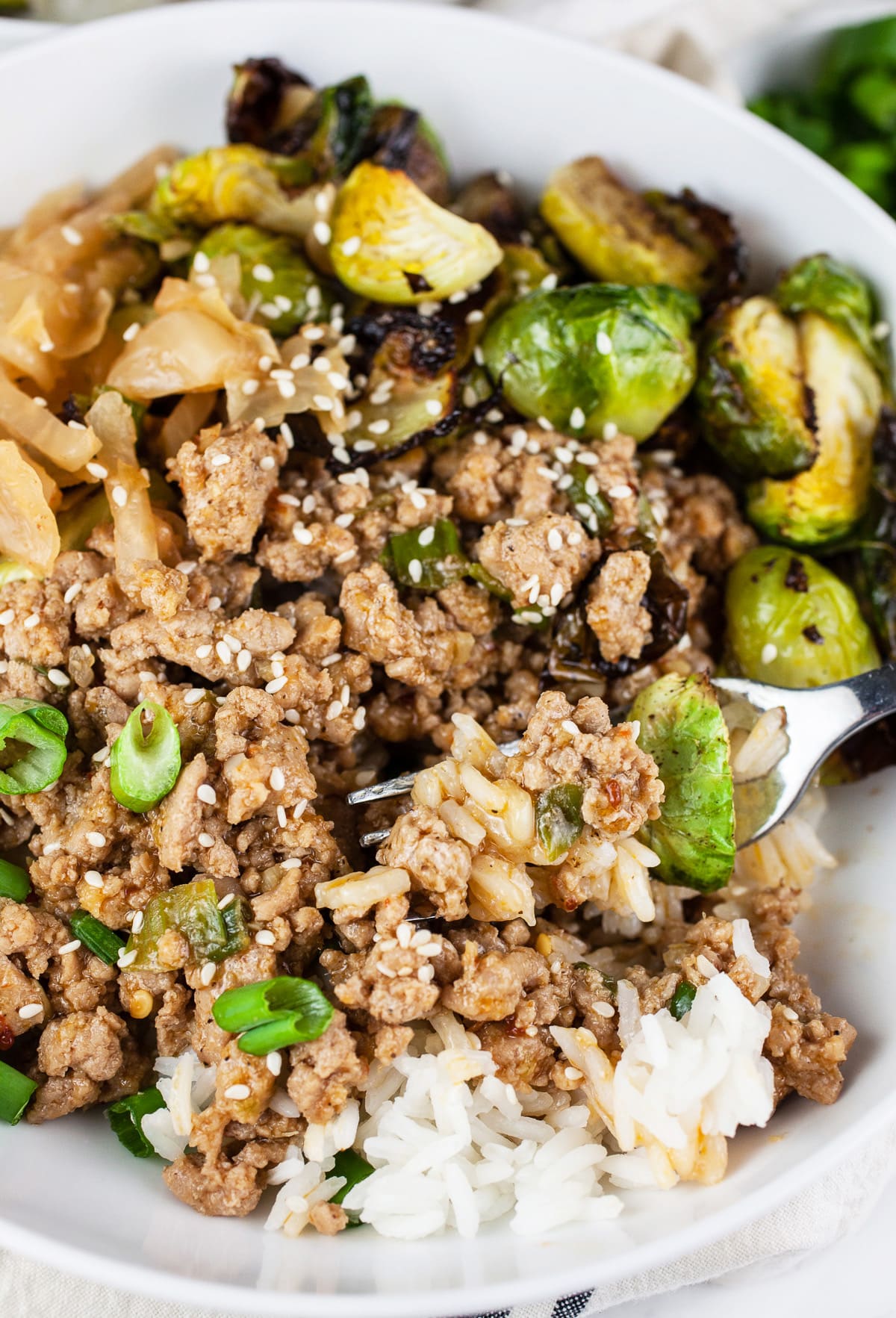 Korean ground turkey rice bowls with kimchi and Brussels sprouts.