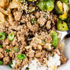 Korean ground turkey rice bowl with kimchi and Brussels sprouts.