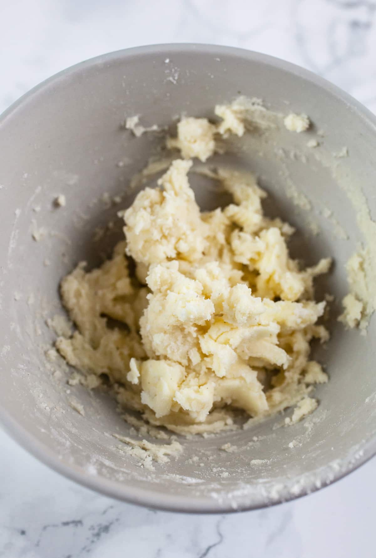 Flour and butter mixture in small grey bowl.