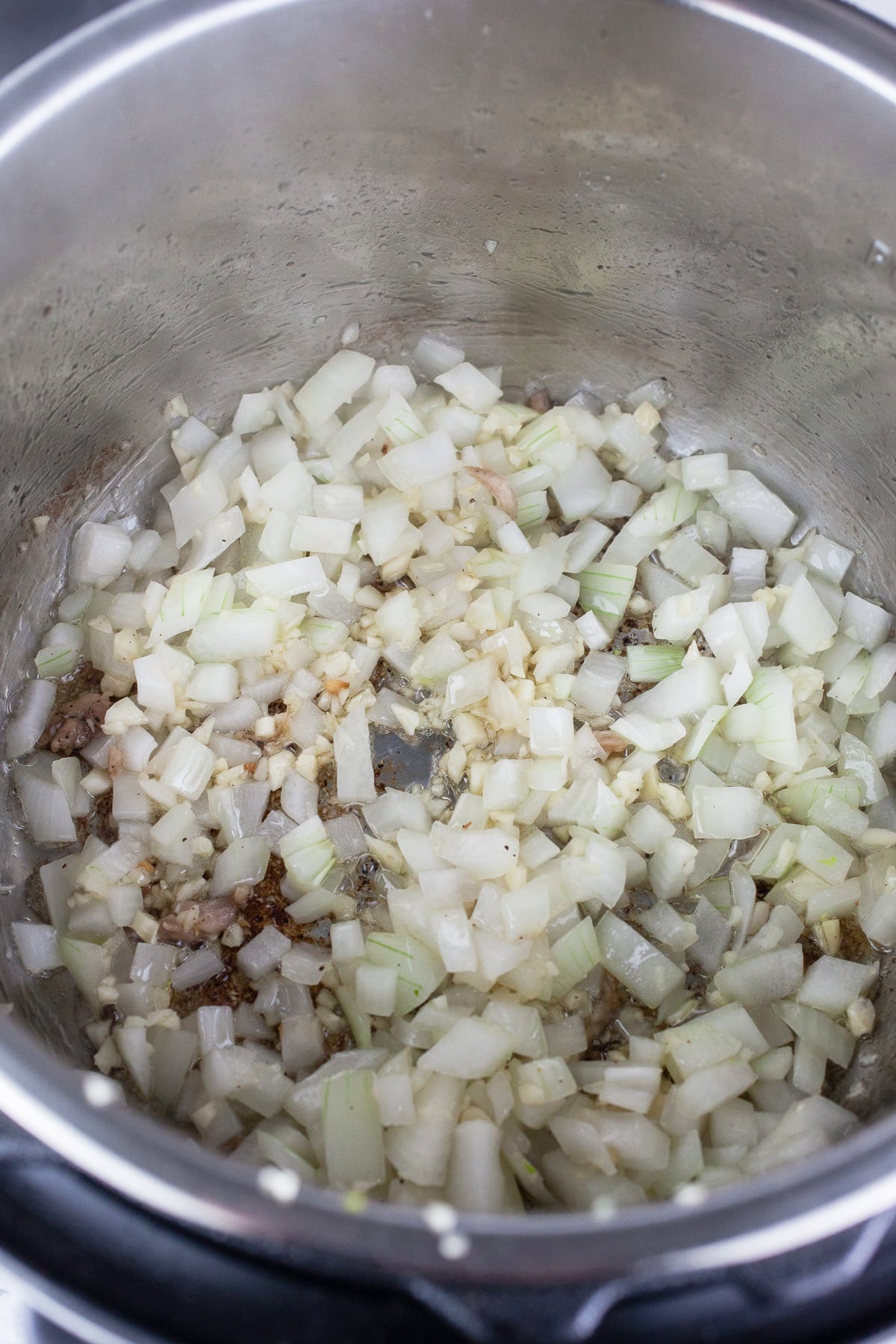 Minced garlic and onions sautéed in Instant Pot.