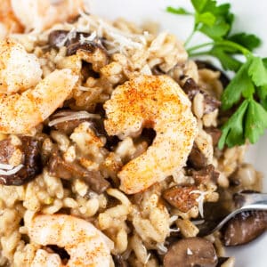 Mushroom shrimp risotto with parsley.