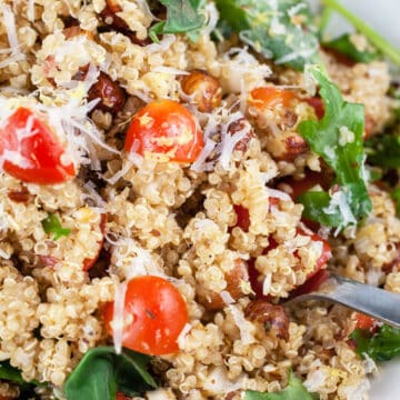 Italian quinoa salad with arugula, tomatoes, and Parmesan cheese.