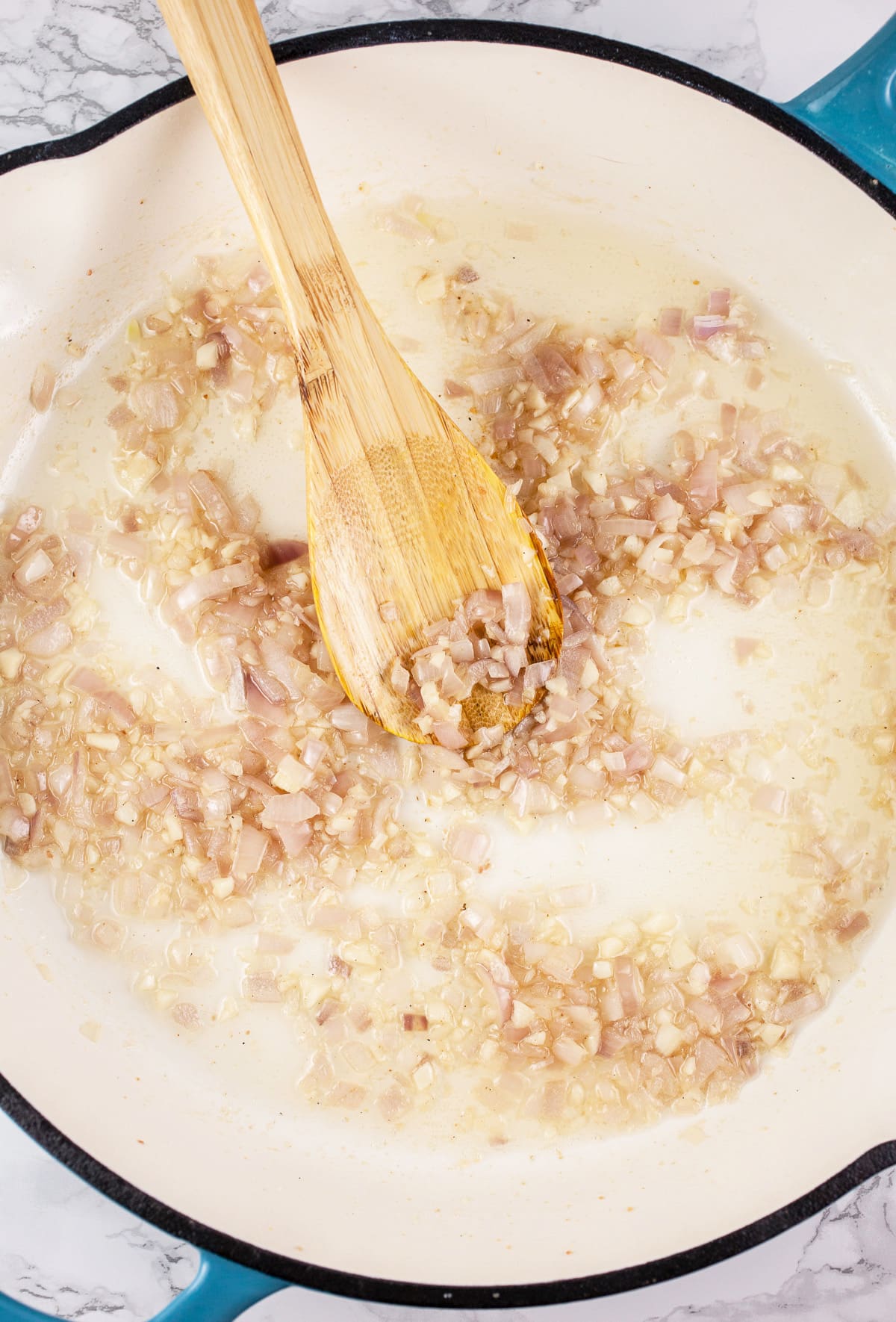 Minced garlic and shallots sautéed in skillet.