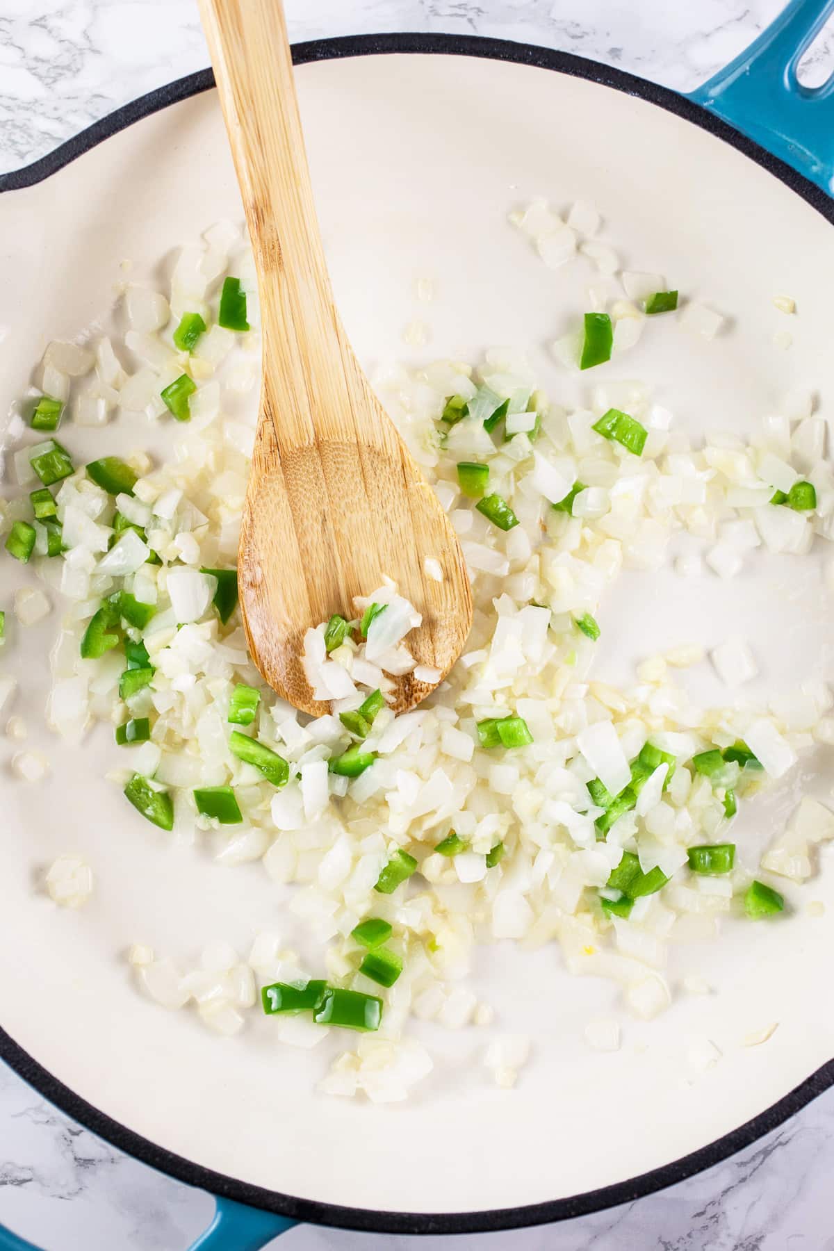 Minced garlic, onions, and jalapeno pepper sautéed in skillet.