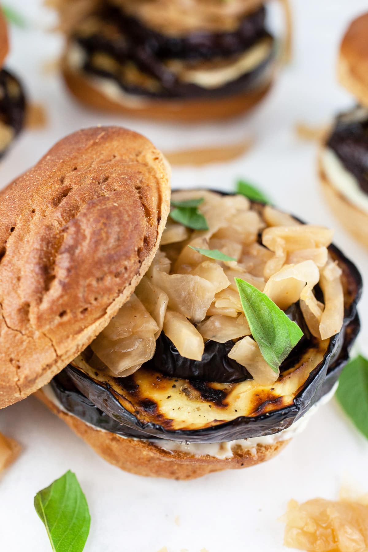 Grilled eggplant sandwiches with kimchi and Thai basil.