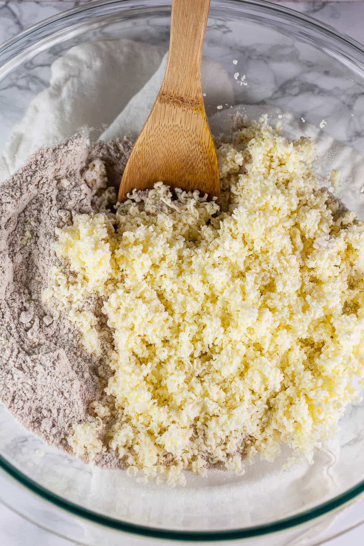 Wet scone ingredients combined in ceramic bowl.