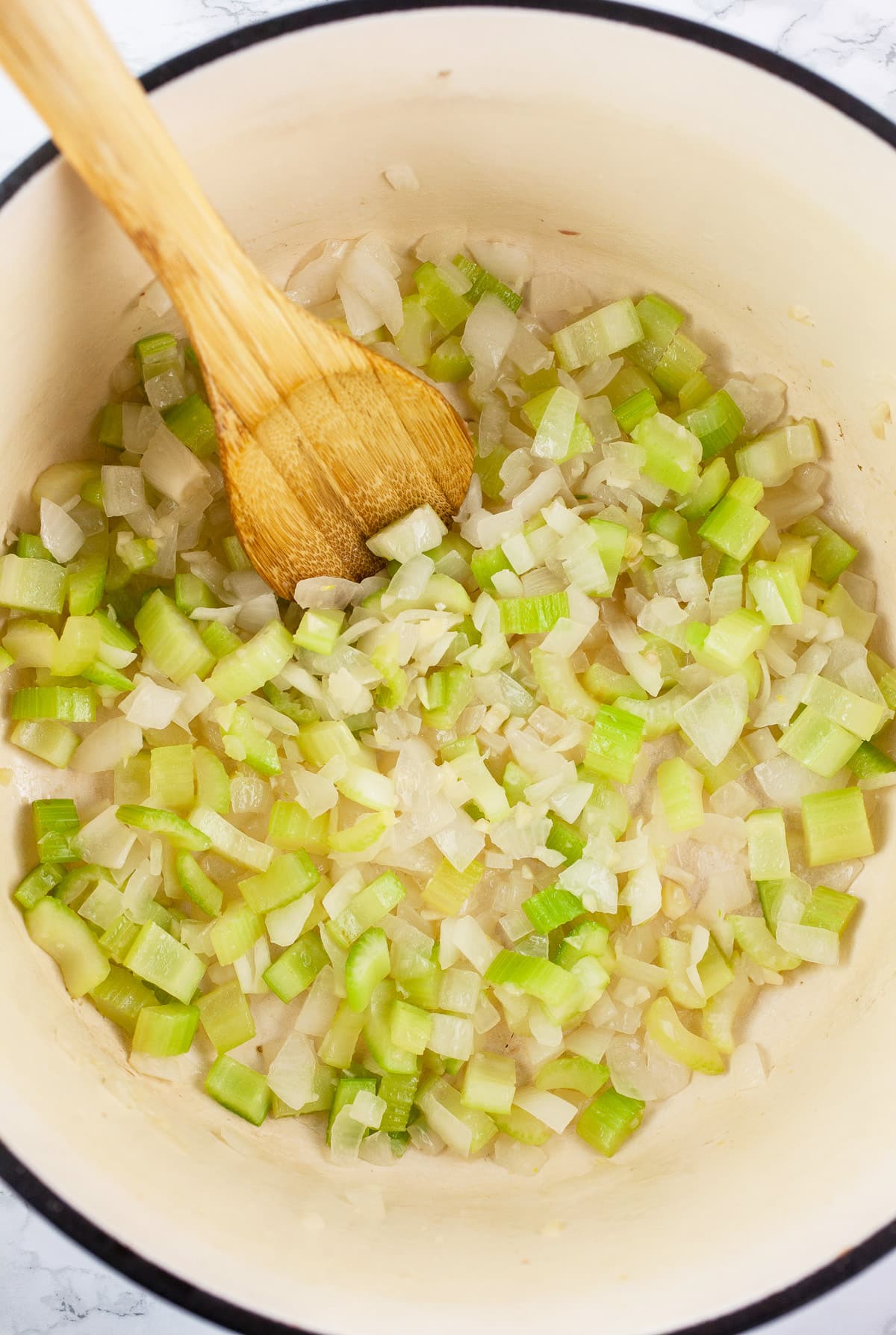 Minced garlic, onions, and celery sautéed in Dutch oven.