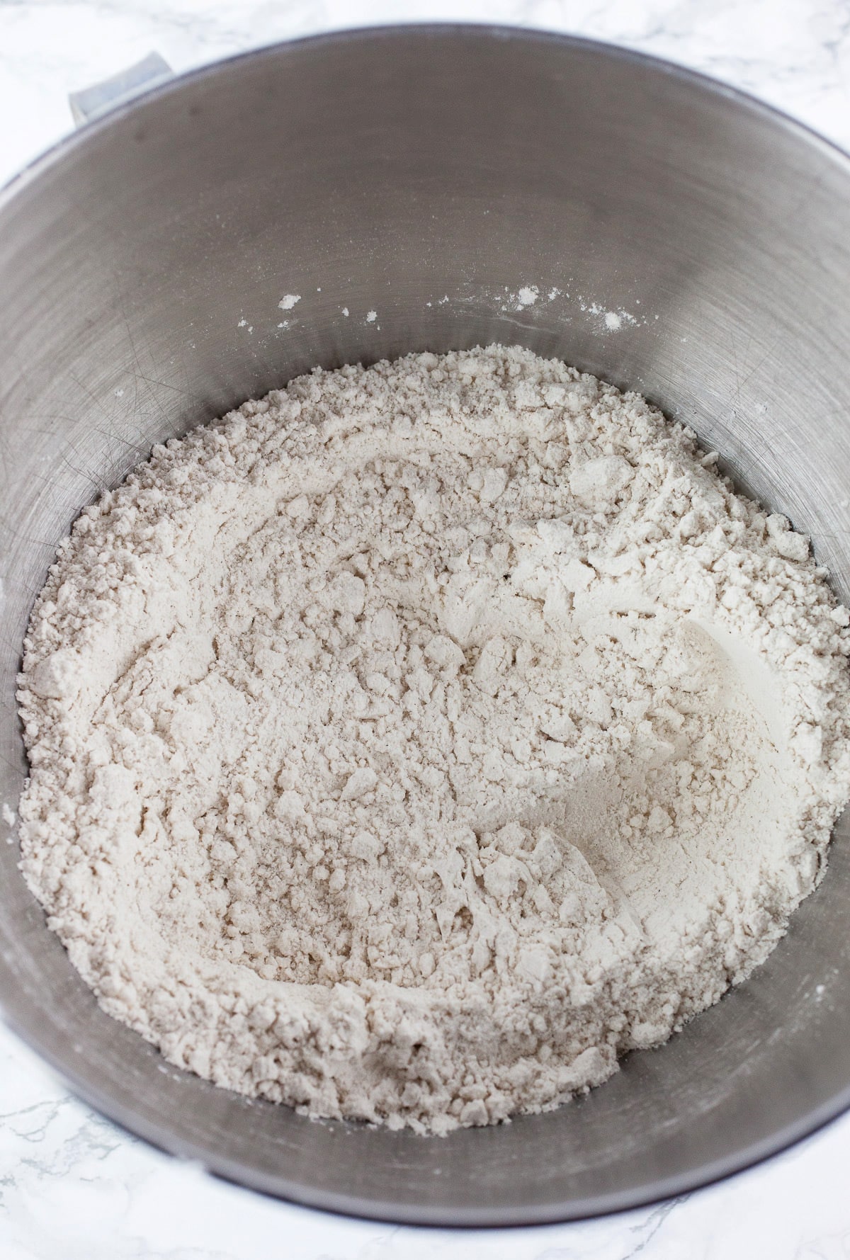 Dry ingredients in stand mixer bowl.