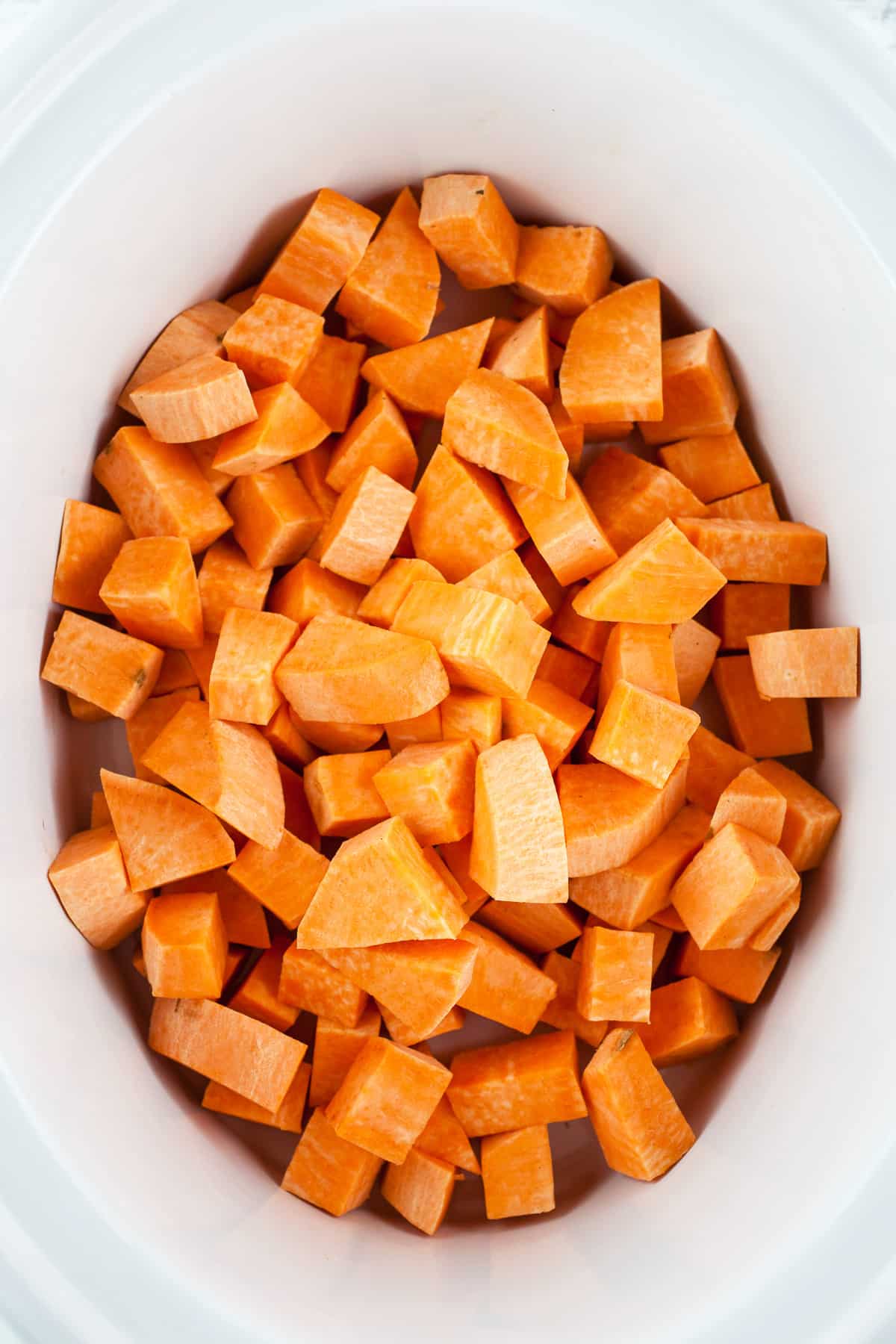 Diced sweet potatoes in slow cooker.