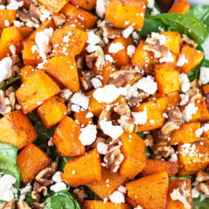 Butternut squash salad with greens, walnuts, and feta.