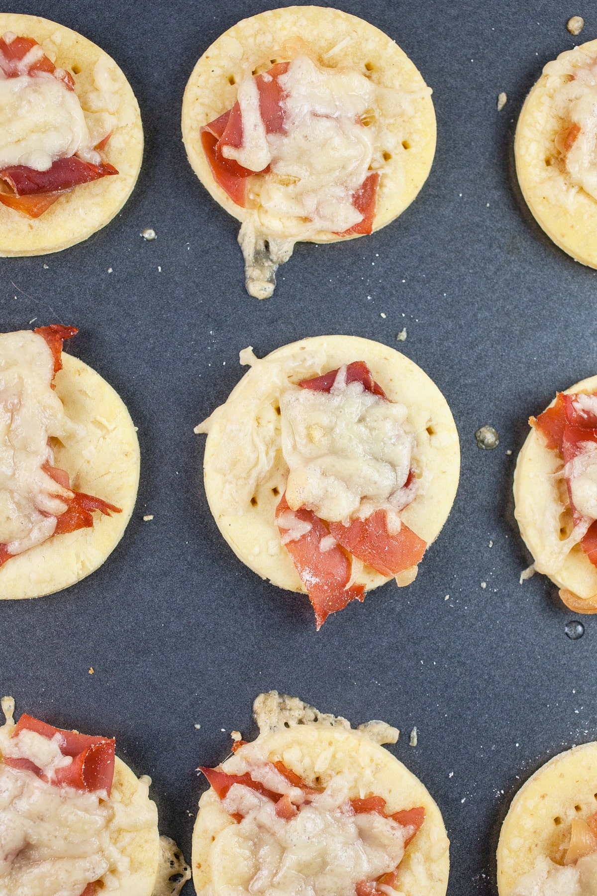 Baked puff pastry tartlets on baking sheet.