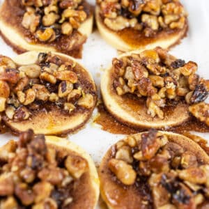 Maple walnut baklava tartlets on white serving platter.