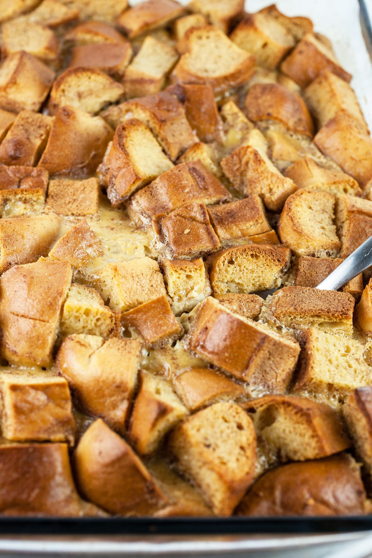 French toast casserole in glass baking dish.