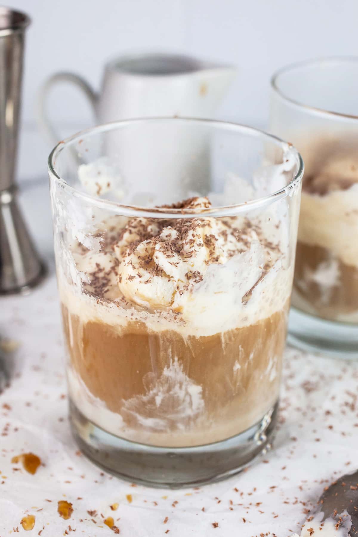 Baileys affogato in glass garnished with chocolate shavings.