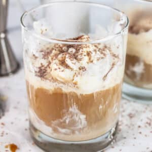 Bailey's affogato in glass garnished with chocolate shavings.