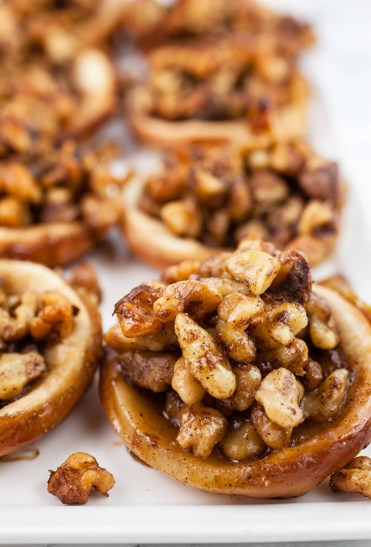 Maple walnut baklava tartlets on white platter.