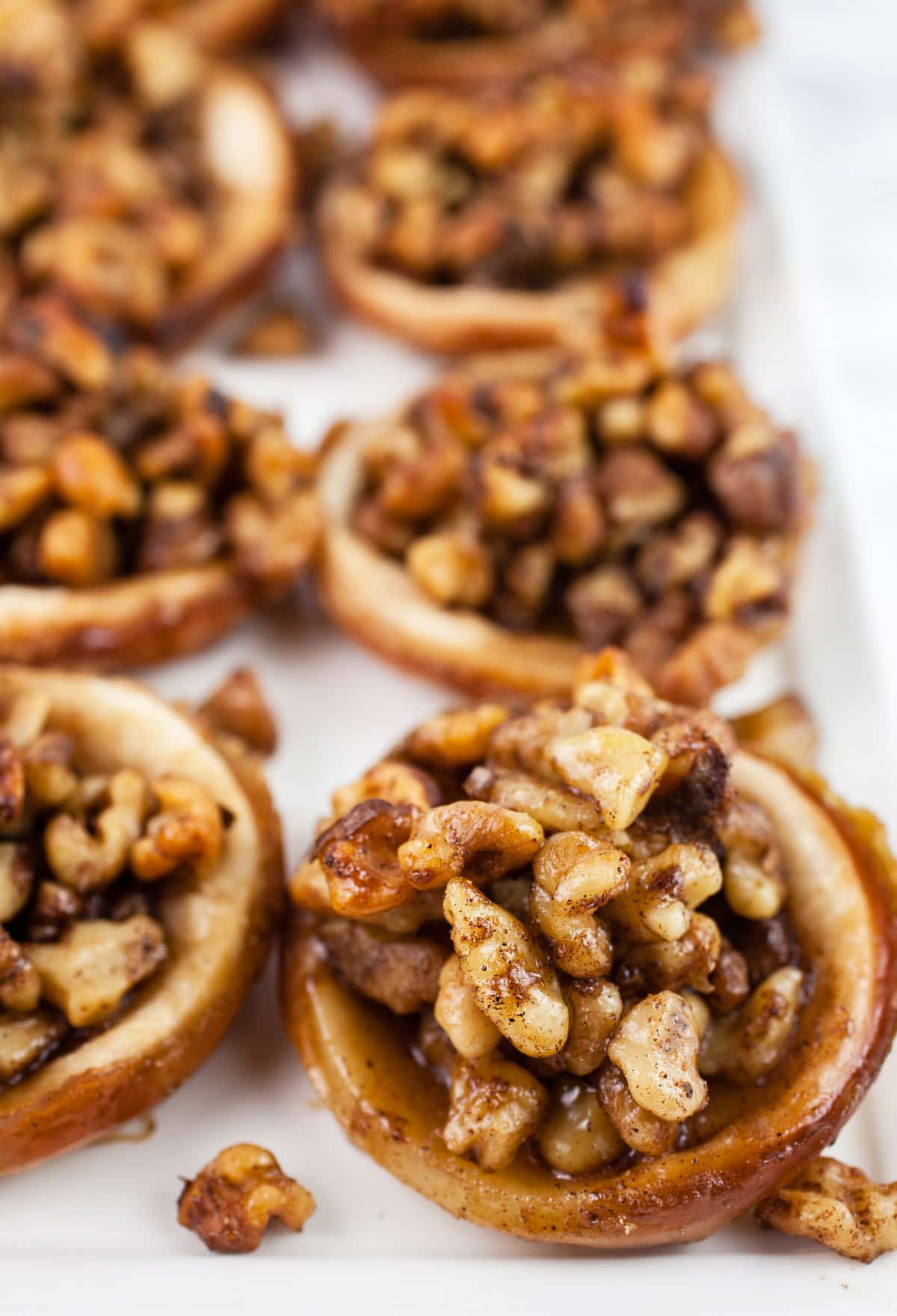 Baklava tartlets on white platter.