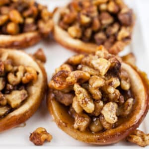 Baklava tartlets on white platter.