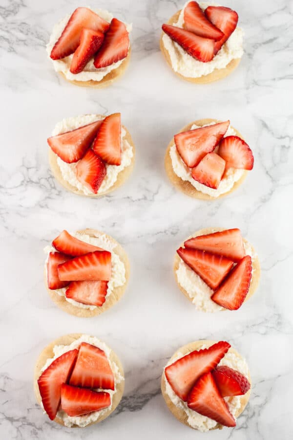 Puff pastry rounds topped with mascarpone cream and fresh strawberries.