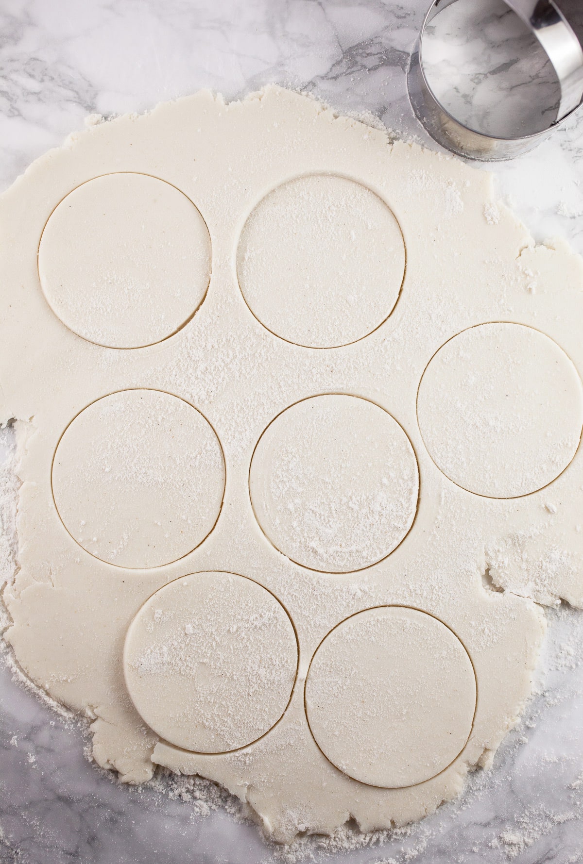 Gluten free puff pastry sheet cut into rounds with biscuit cutter.