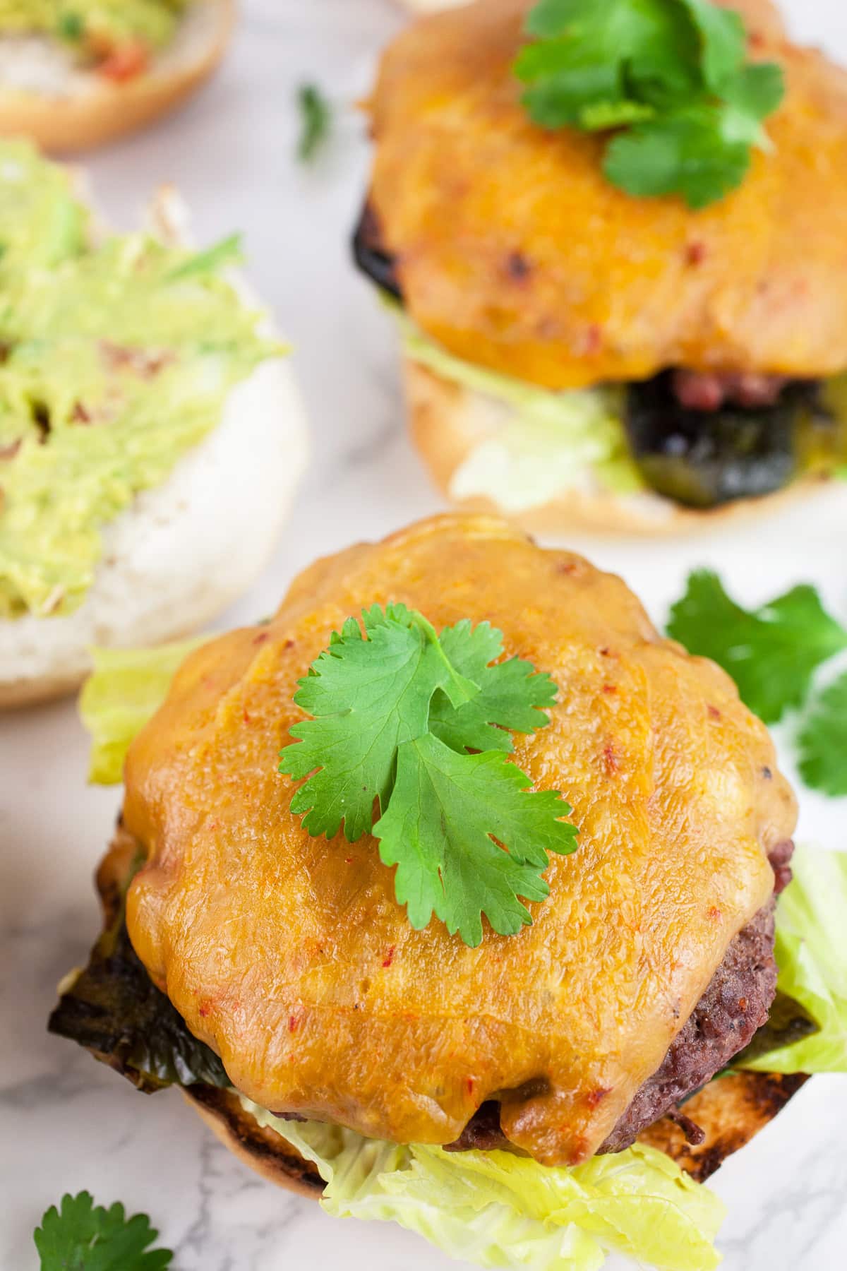 Southwest poblano burgers with melted cheese and cilantro.