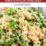 Smoked salmon arugula quinoa salad with asparagus in white bowl.