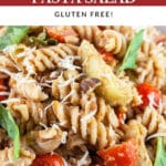 Sundried tomato pesto pasta salad with artichokes, tomatoes, Parmesan cheese, and basil.