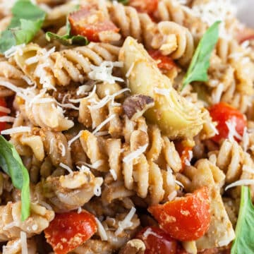 Sundried tomato pesto pasta salad with artichokes, basil, and Parmesan cheese.