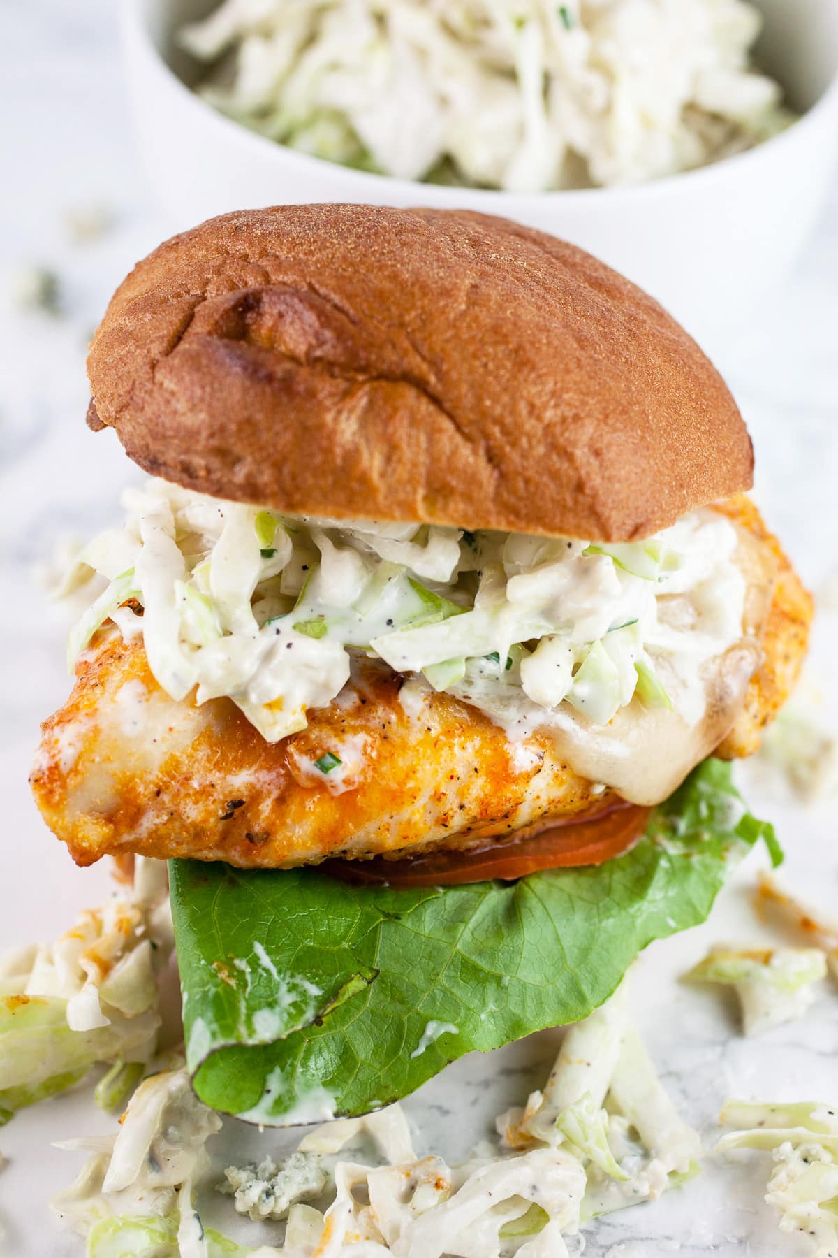 Buffalo chicken sandwich  topped with blue cheese coleslaw.